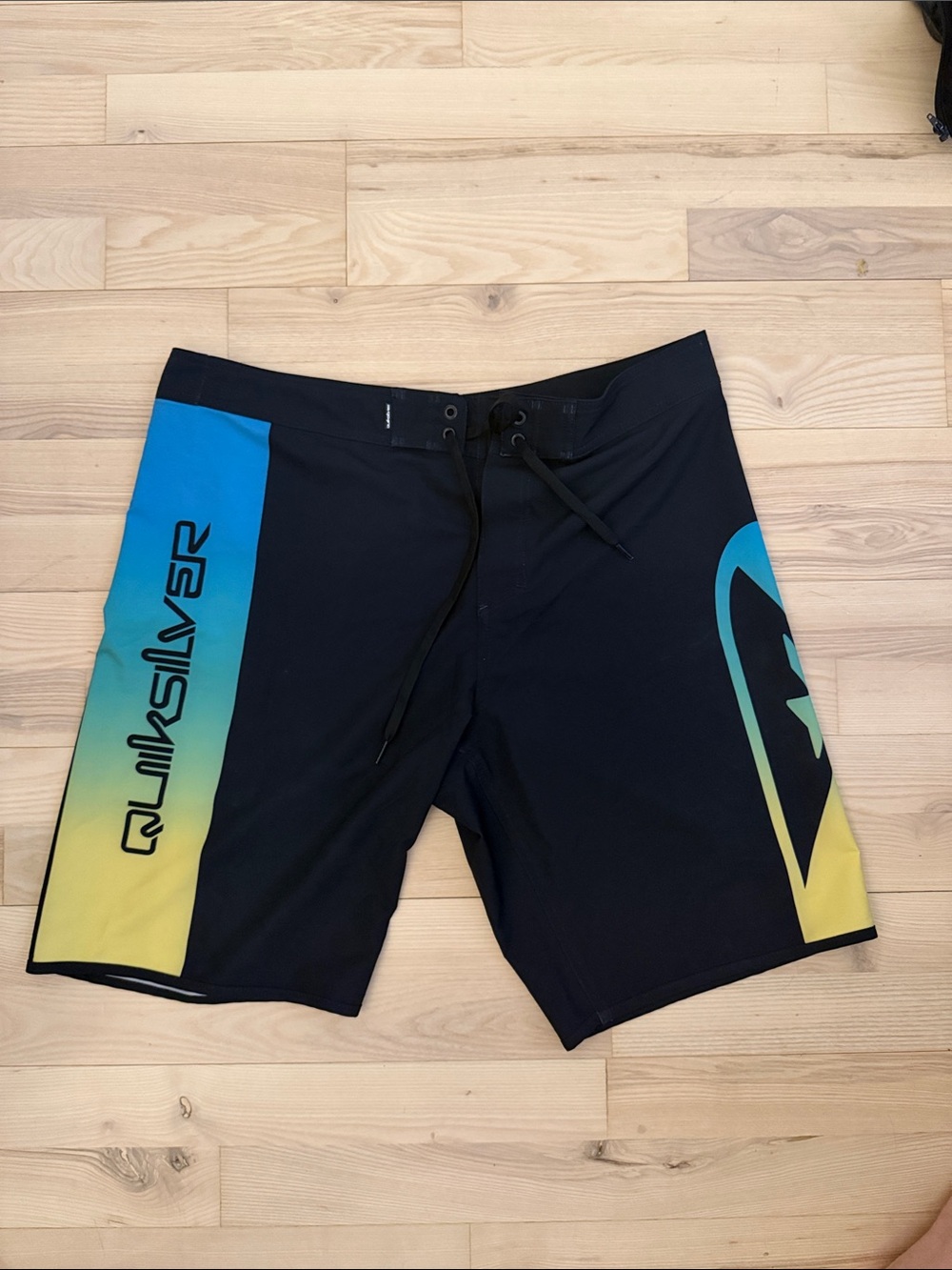 Quiksilver Men’s Black Boardshorts with Blue and Yellow Gradient Panels